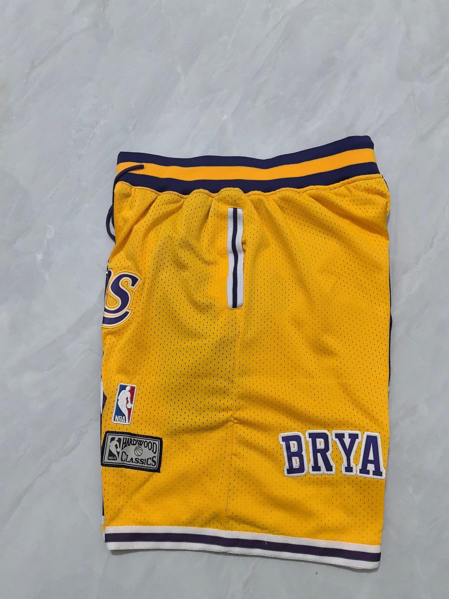 LOS ANGELES LAKERS KOBE BRYANT PURPLE AND YELLOW SHORTS
