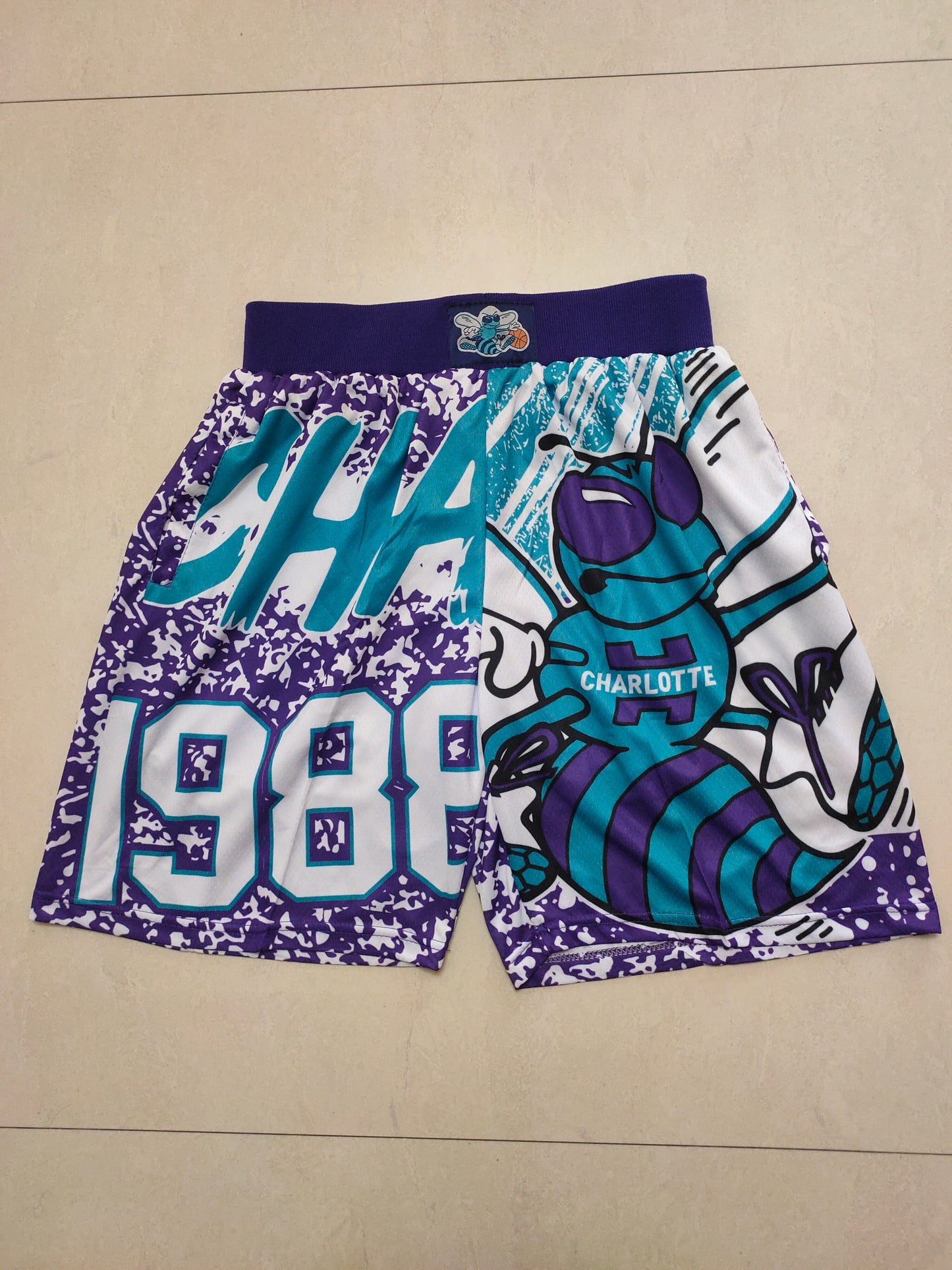 CHARLOTTE HORNETS PURPLE SHORTS